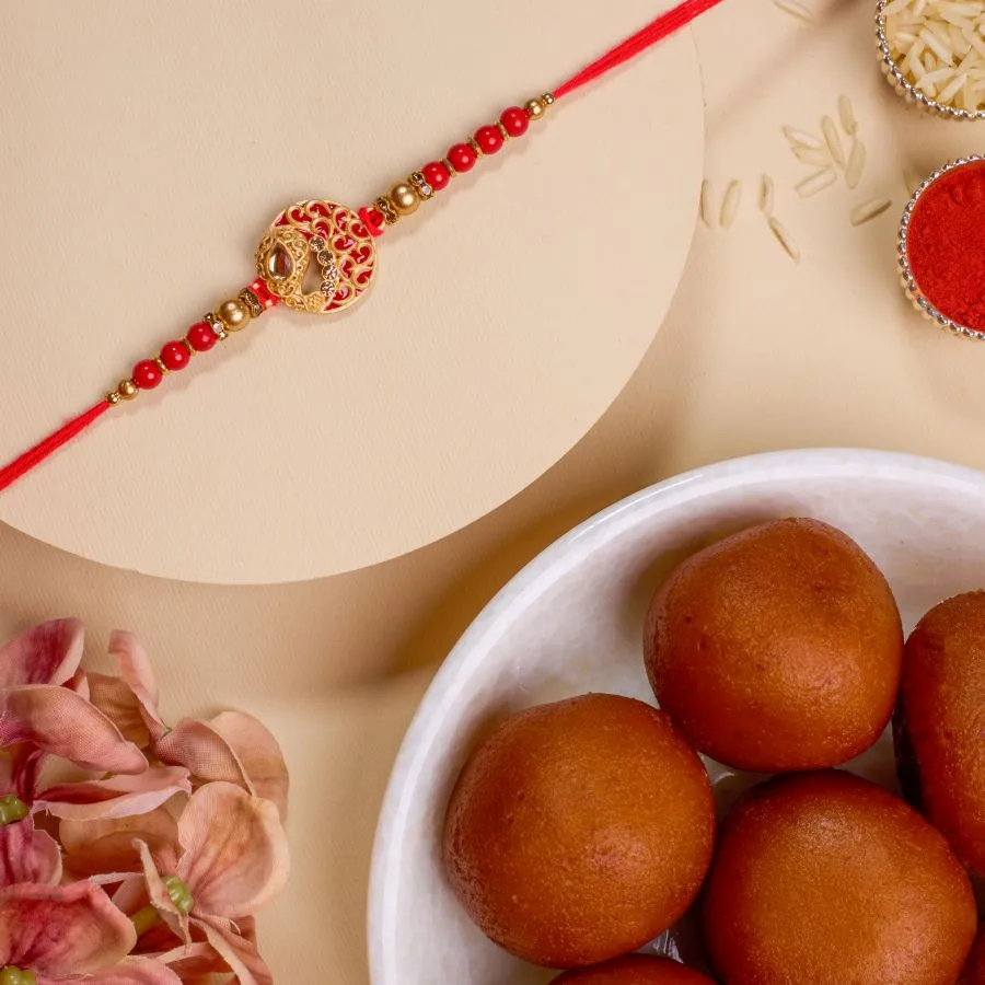 Elegant Kundan Rakhi with Gulab Jamun Treat