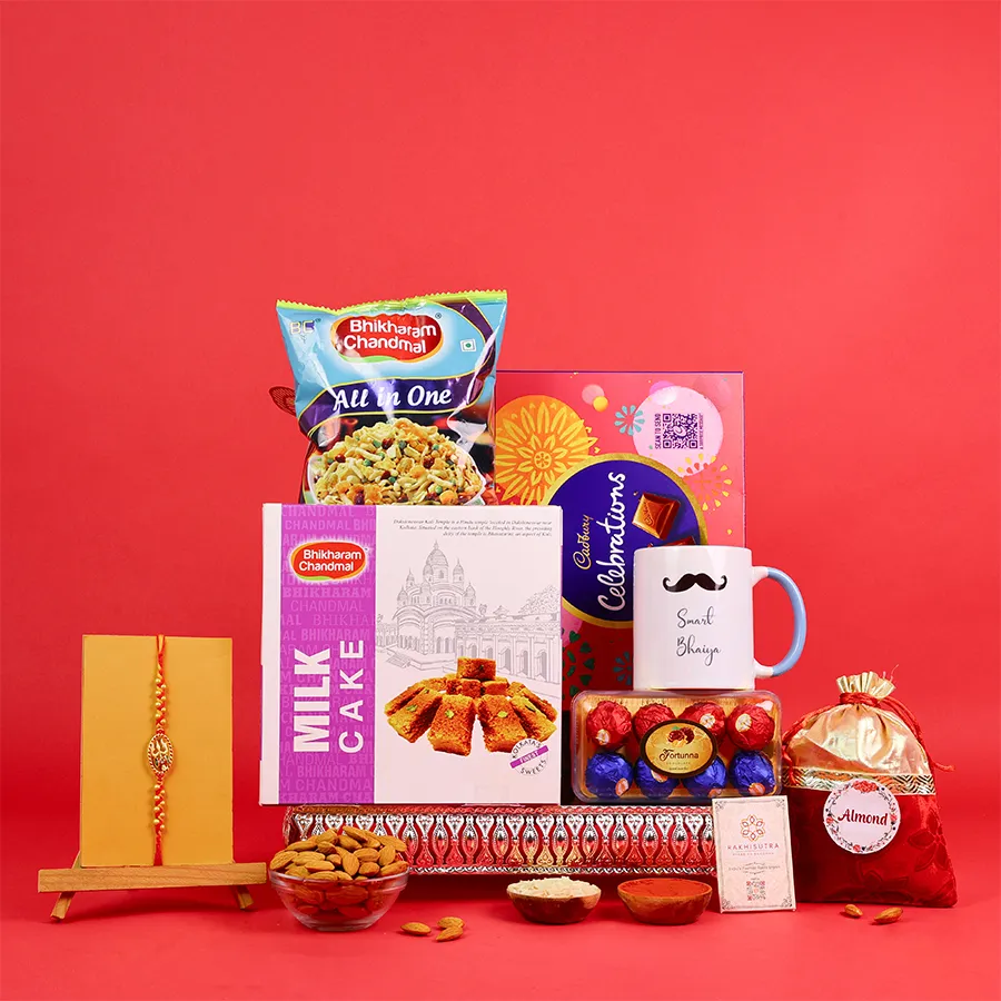 Festive Rakhi gift box with sweets and a mug