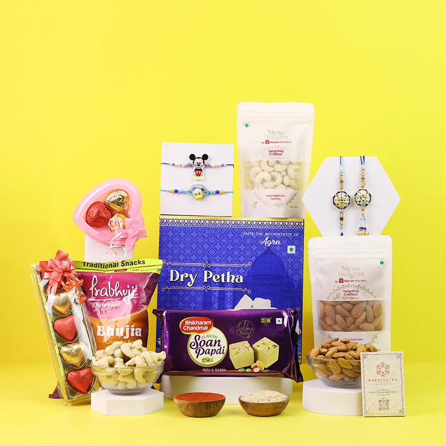 Sweet Rakhi hamper with rakhis and treats