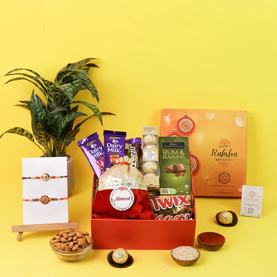 Om and Ganesh Rakhi with assorted chocolates and almonds