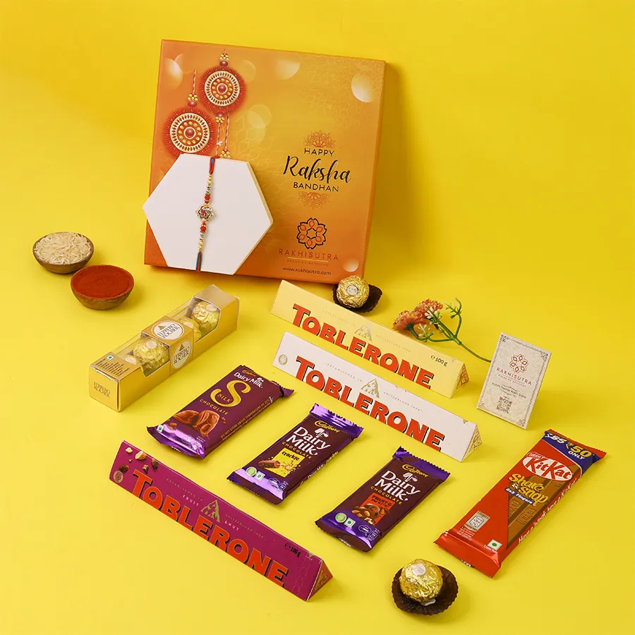Swastik Rakhi and assorted chocolates in a gift box.