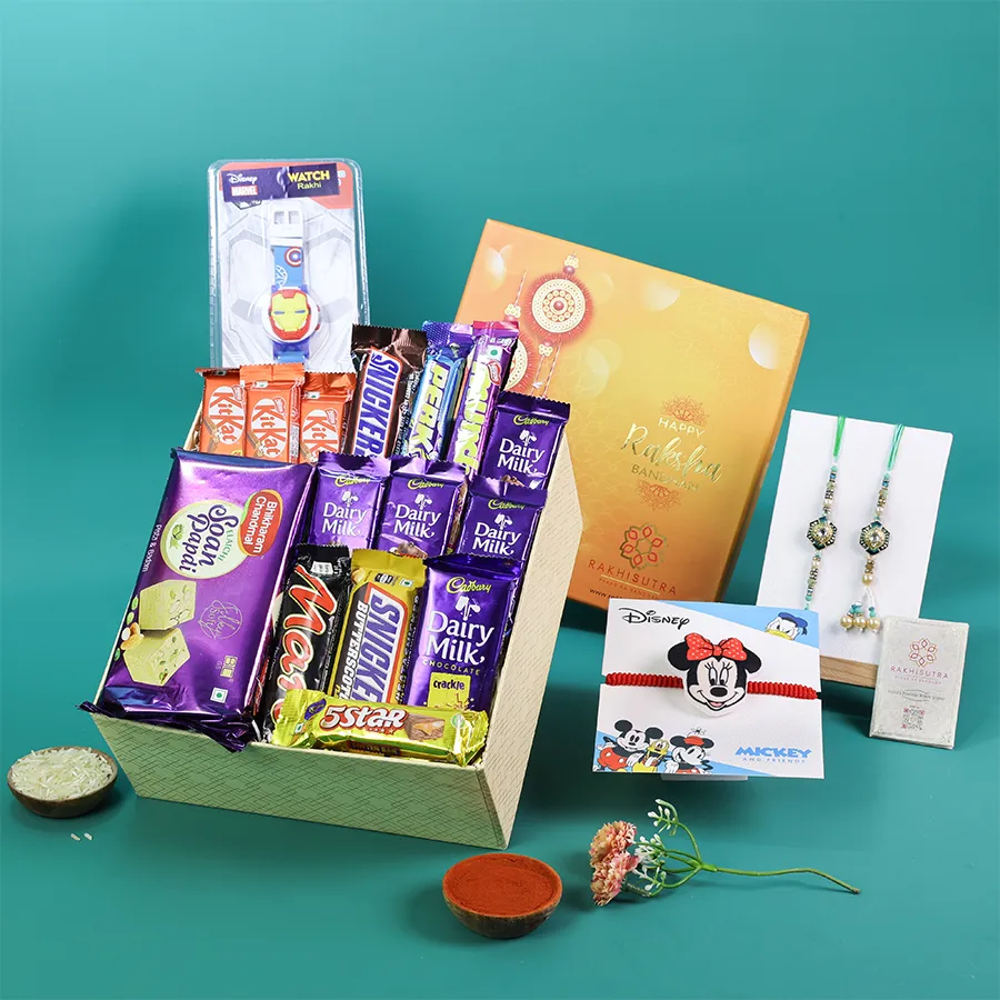 A vibrant family Rakhi gift box featuring traditional Rakhis and assorted chocolates.