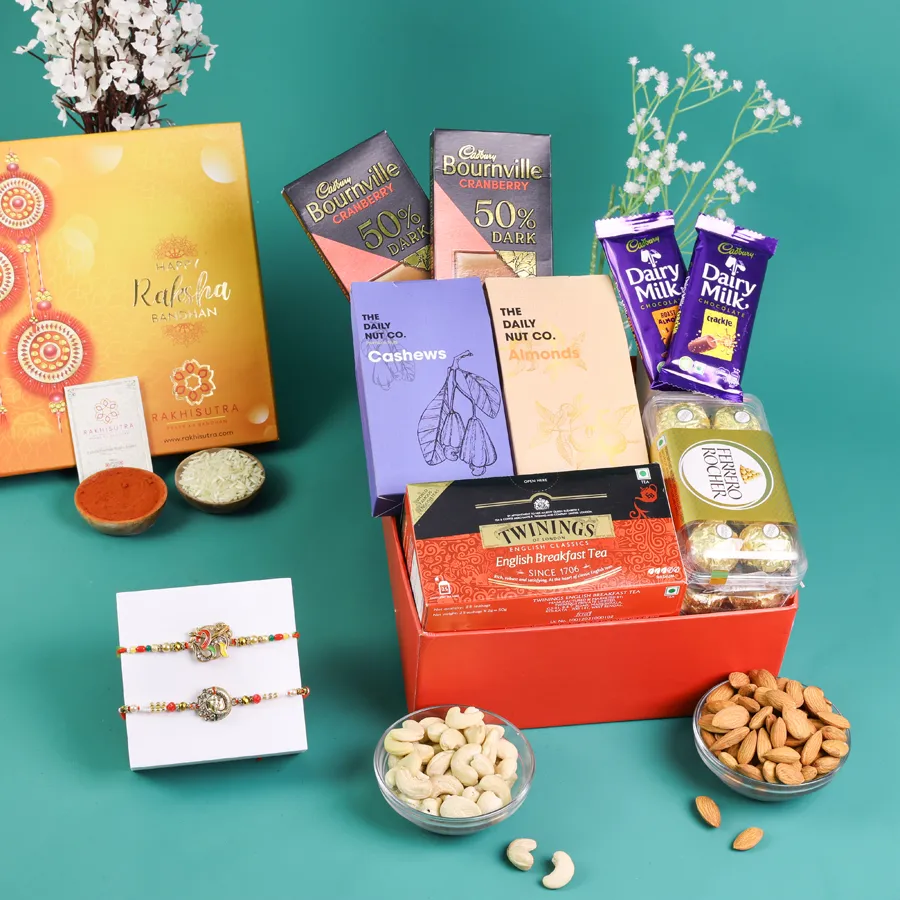 Sacred Rakhi and gourmet treat box with chocolates and nuts